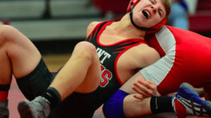a wrestlers fighting his opponent showing one of the wrestling tactics